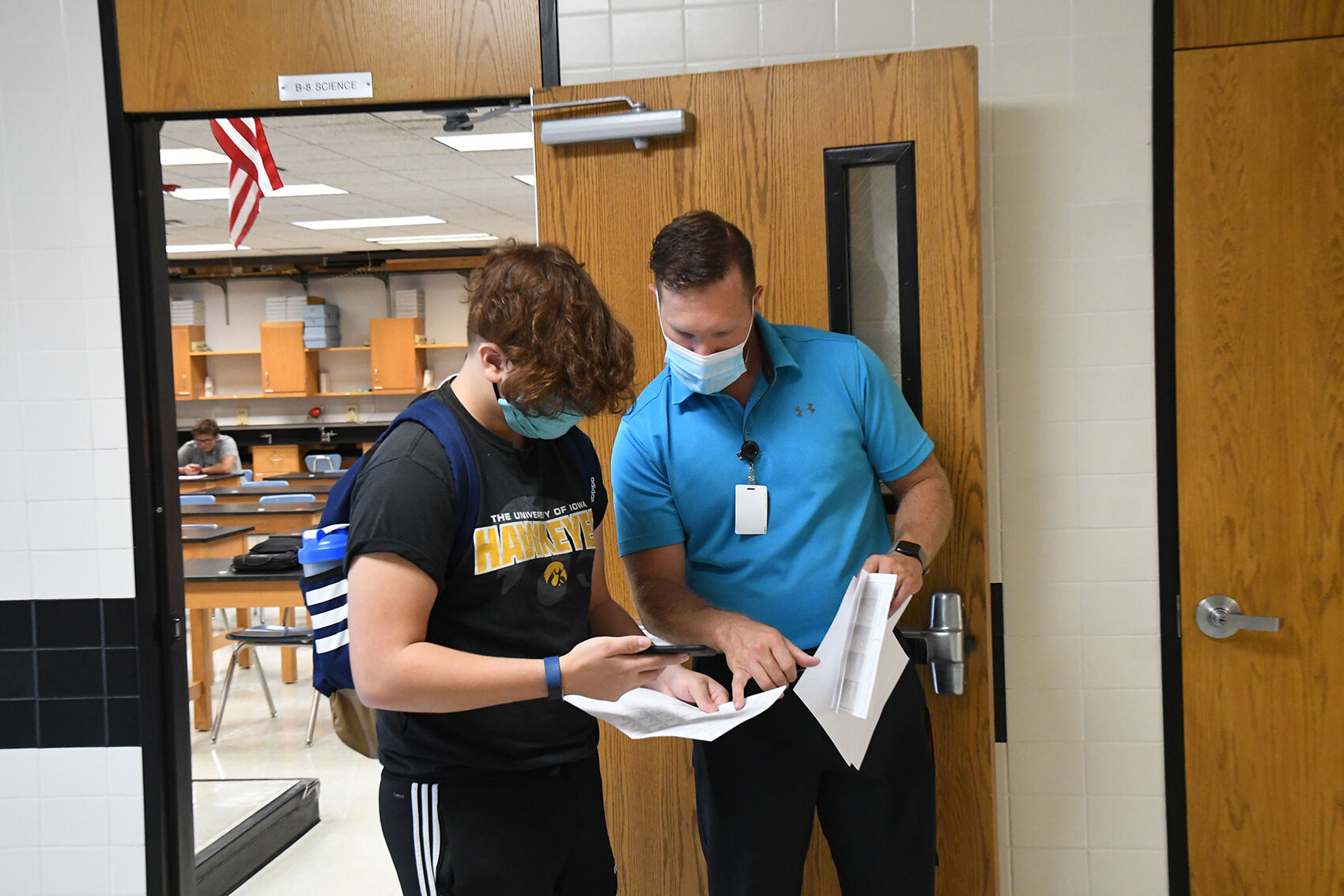 Heath Anderson helps student on first day